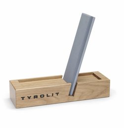 Compact knife sharpener made of wood and metal, designed for easy and efficient sharpening of knives.