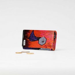 Vibrant red folding wallet with floral design, made of durable Tyvek material, suitable for carrying cards and cash.