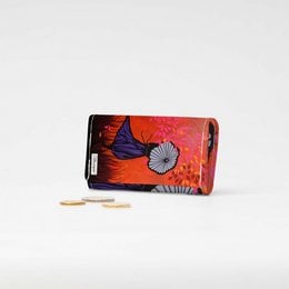 Vibrant red folding wallet with floral design, made of durable Tyvek material, suitable for carrying cards and cash.