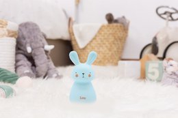 Blue USB-rechargeable night light in the shape of a rabbit, suitable for children's rooms.