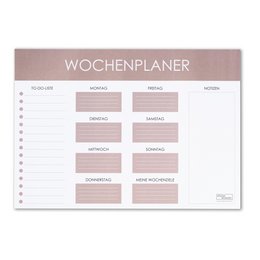 A large weekly planner desk pad in a neutral color palette with sections for each day of the week. The planner has a clean, minimalist design and appears to be made of high-quality materials.