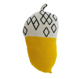 Decorative mustard yellow and white patterned cushion in the shape of an acorn, suitable for a child's room.