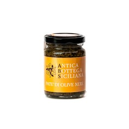 Black olive pate in a glass jar with a label that says "Antica Bottega Siciliana". The pate appears to be a dark, spreadable olive-based product.