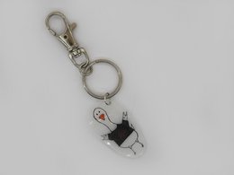 Keychain with a goose design, featuring a metal ring and a small charm with a goose silhouette and red beak.