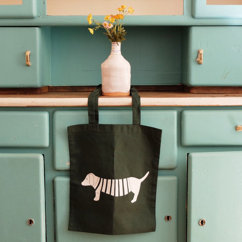 hand-printed fabric bag with green dachshund motif