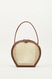  Brown woven handbag with round shape and leather trim.