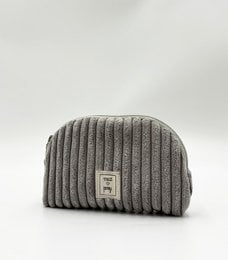 Grey corduroy vanity bag with waterproof interior, suitable for storing makeup and other personal items.