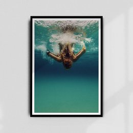 Underwater poster featuring a person swimming underwater in a turquoise pool.