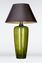 Tall, narrow green glass table lamp with black fabric lampshade.