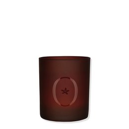 Tall, round, burgundy-colored scented candle with a star design.