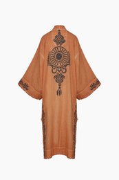  Long, loose-fitting orange kimono with intricate black floral embroidery along the sleeves and hem.