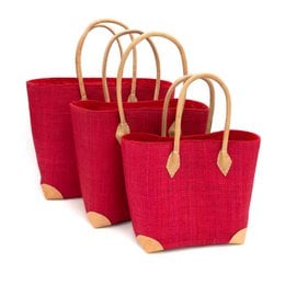 Red handcrafted woven basket with natural rattan handles and tan leather accents, storage organizer.