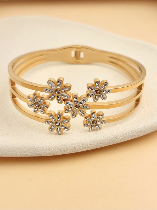 Bracelet jonc doré en acier inoxydable avec fleurs strassées