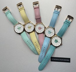 Stylish pastel-colored watches with minimalist designs, featuring leather straps in mint, yellow, pink, and blue hues.