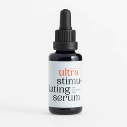 Ultra stimulating serum, a toner product in a dark glass bottle with a dropper. The product is designed to provide a stimulating effect for the skin.