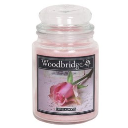  Large, round, pink scented candle with a floral rose design on the label.