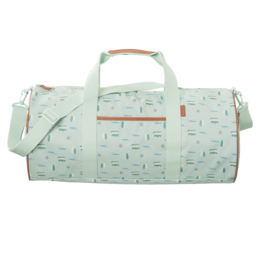 Large mint green weekender bag with white and orange geometric patterns, leather accents, and a detachable shoulder strap.
