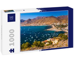  A 1000-piece puzzle depicting a scenic coastal town with mountains in the background. The image shows a picturesque harbor with boats and buildings along the shore.