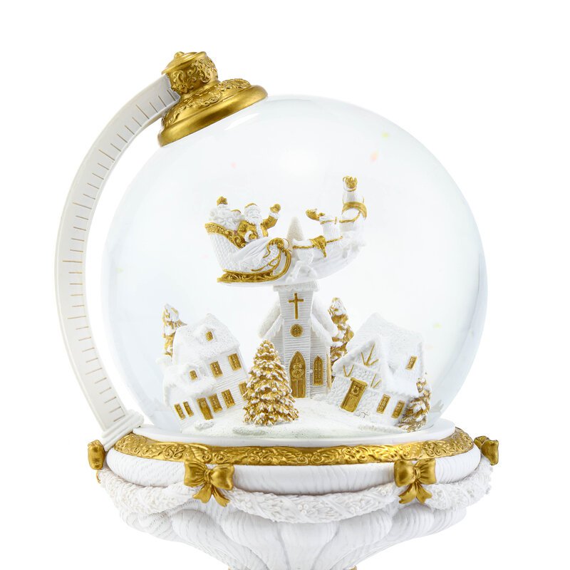 Die kugelförmige Weihnachtsschneekugel mit automatischem Schneesturm und Lichtern.