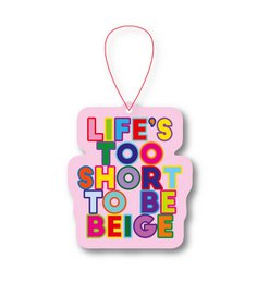 Pink air freshener with colorful text "Life's too short to be beige" motivational quote design.