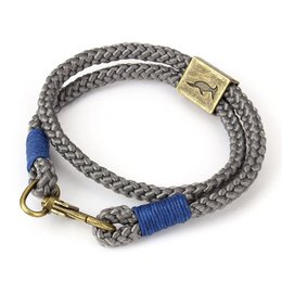 A grey and blue woven bracelet with a metal clasp, suitable for men.