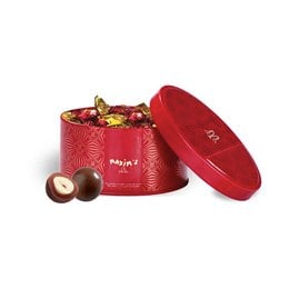 Tin of milk chocolate-covered hazelnuts, 40g. Chocolate gifts. Oval-shaped tin in red color with floral pattern. Contains milk chocolate-coated hazelnuts.