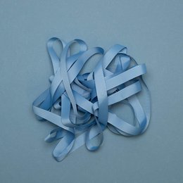 Cornflower blue ribbon with a decorative, looped design. Suitable for gift wrapping, crafting, and decorative purposes.