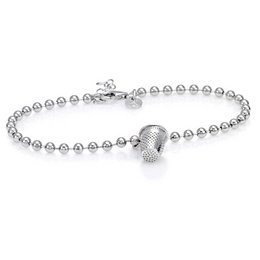 Silver-toned bangle bracelet with heart-shaped charm