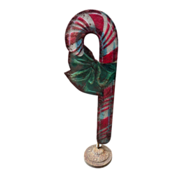  Festive candy cane-shaped standing decoration with green leaves and red and white striped pattern.