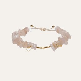Soft pink beaded bracelet with golden hearts. Charm bracelet made of natural stones and metal accents.