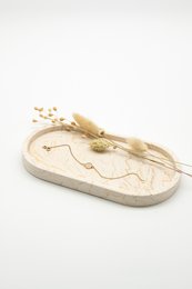Oval decorative tray made of sandstone with a natural, earthy appearance. Features a unique, organic shape and texture.