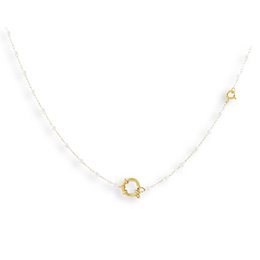 A delicate gold-tone chain necklace with a single pearly charm pendant.