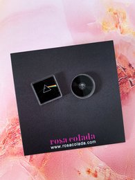Pink Floyd-inspired stud earrings with a triangular and circular design in black and pink.