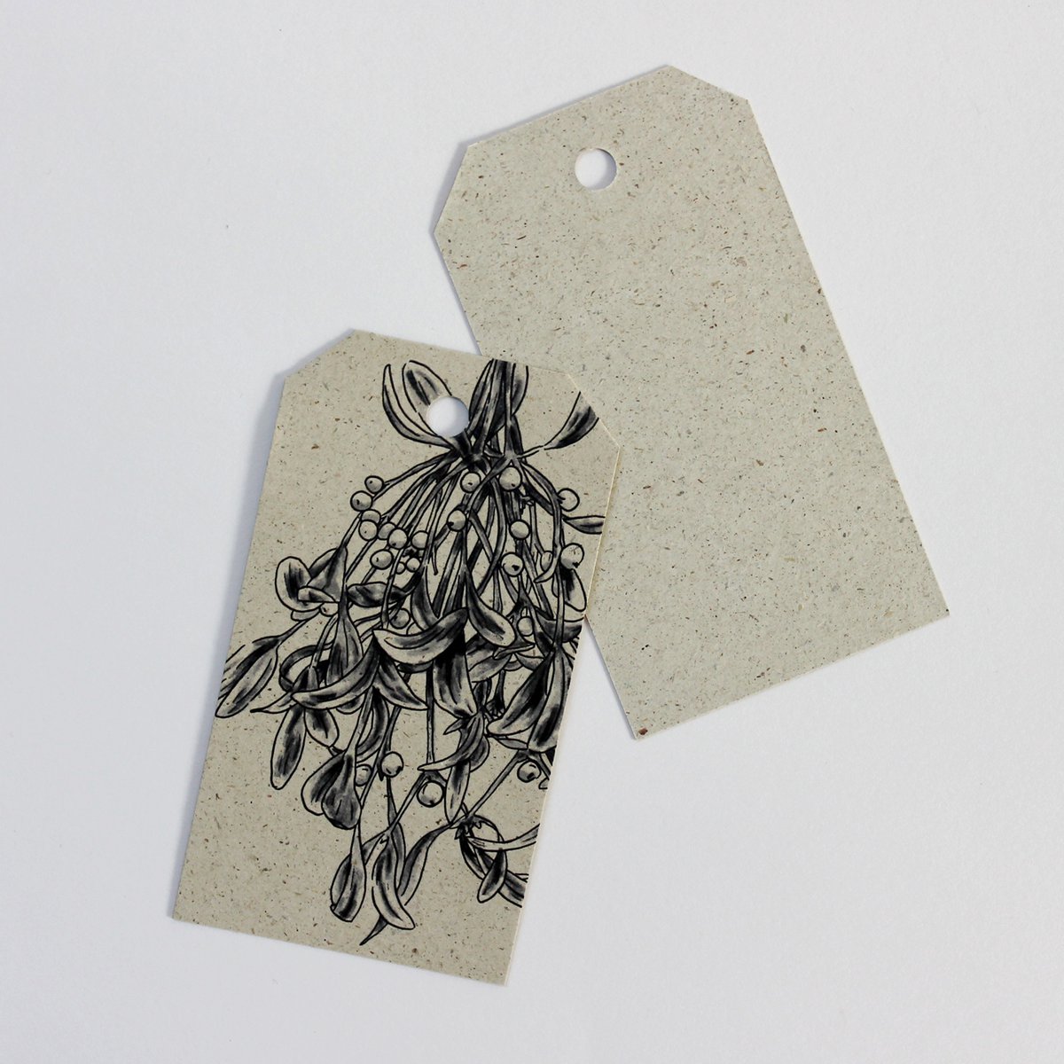 Gift tags made from grass paper, mistletoe