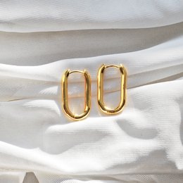 Elegant gold-tone hoop earrings with a modern, minimalist design. Crafted from high-quality metal for a durable and long-lasting wear. Suitable for both casual and formal occasions.