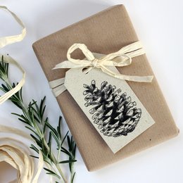 Grass paper gift tags with pine cone design, natural and rustic style.