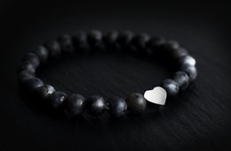 Black beaded bracelet with heart charm