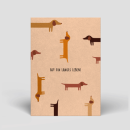 Postcard with a birthday message and illustrations of dachshund dogs in various poses.