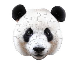 A white puzzle with a panda face design. The panda has large black eyes and ears, and a black and white face.