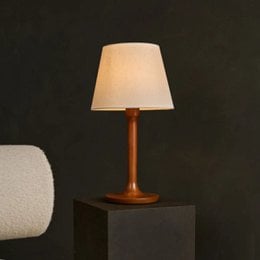  Chestnut brown table lamp with wooden base, suitable for stylish living room or bedroom lighting.