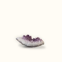 Amethyst cluster with varying sizes, featuring a natural, irregular shape and a deep purple color.