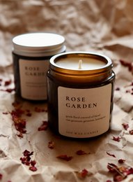 Rose garden, natural soy wax candle with essential oils, scented with rose fragrance, in a glass container.