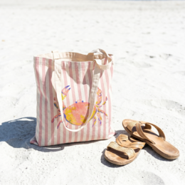  Tote bag with watercolor crab motif, striped canvas material, shoulder handles, beige and pink colors.