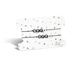 Two black and white beaded bracelets with the text "BFF" on a patterned background.