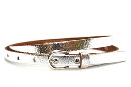 Metallic leather belt in various colors including pink, green, blue, silver, and gold. The belt has a classic buckle closure and is made of 100% cowhide leather.