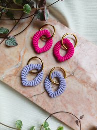 Colorful swirl statement earrings, pink and purple, circular spiral design, bold fashion jewelry.