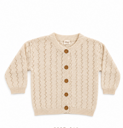 Cream cable knit cardigan with button front, textured knit pattern, long sleeves, baby clothing.