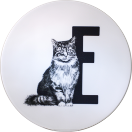 A round white plate with a black and white image of a cat sitting next to the letter 'E'.
