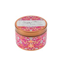  A round, decorative candle tin with a floral pattern in shades of pink and blue. The tin is labeled "Library of Flowers" and contains a scented candle.