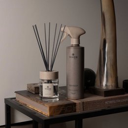 Home perfume spray in nature-inspired scents like "Nature's Best" and "There's No Planet B". Minimalist, neutral-toned packaging.